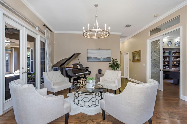 living area with dark wood finished floors, crown molding, and french doors