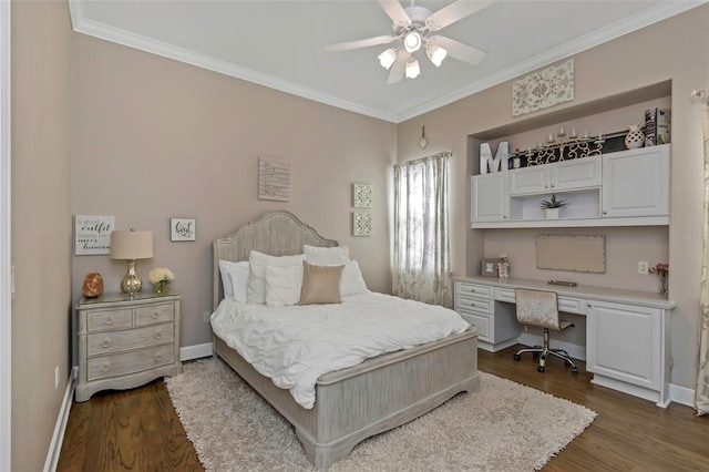 bedroom with baseboards, a ceiling fan, dark wood-style floors, ornamental molding, and built in desk