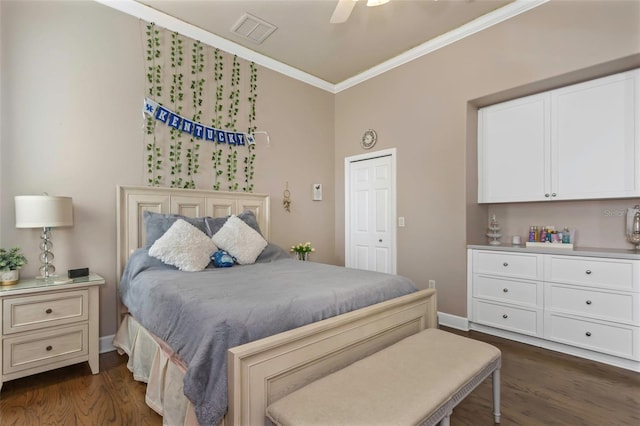 bedroom featuring dark wood-style floors, visible vents, crown molding, and baseboards