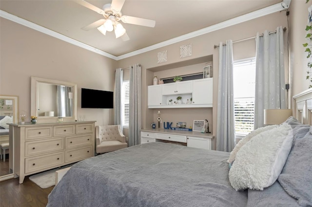 bedroom featuring ornamental molding, dark wood finished floors, and a ceiling fan