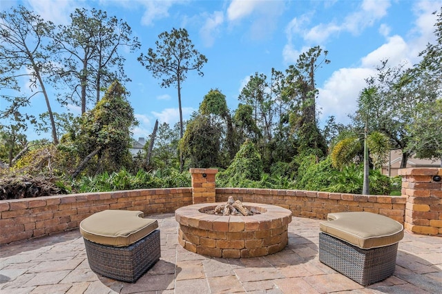 view of patio featuring an outdoor fire pit