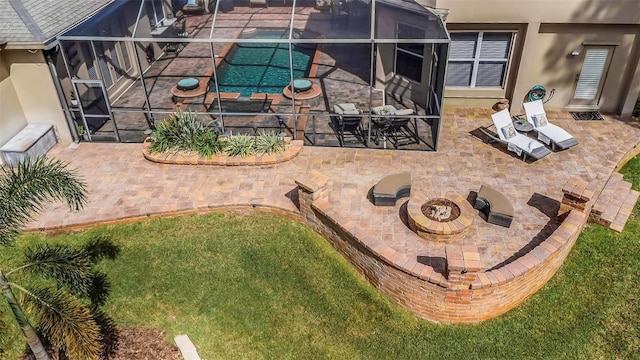 exterior space with an outdoor fire pit and stucco siding