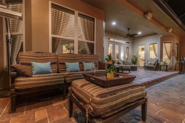 interior space with an outdoor hangout area, french doors, and a ceiling fan