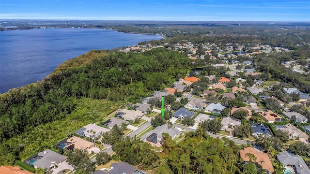 birds eye view of property with a water view and a residential view