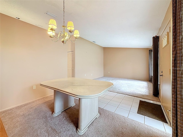 interior space featuring a chandelier, light tile patterned floors, light colored carpet, visible vents, and hanging light fixtures