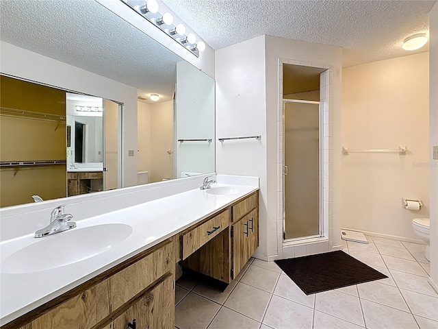 full bathroom with a sink, tile patterned flooring, and toilet