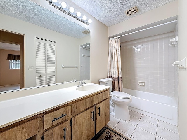 bathroom with shower / tub combo, toilet, tile patterned floors, a textured ceiling, and vanity