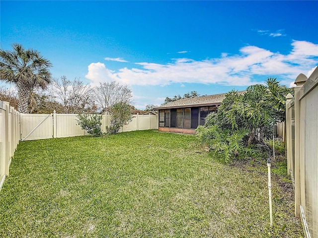 view of yard with a fenced backyard