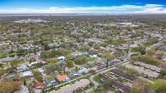 drone / aerial view with a water view and a residential view