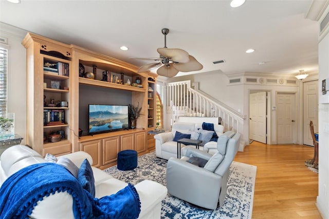 living area featuring recessed lighting, visible vents, stairway, light wood-style flooring, and ceiling fan