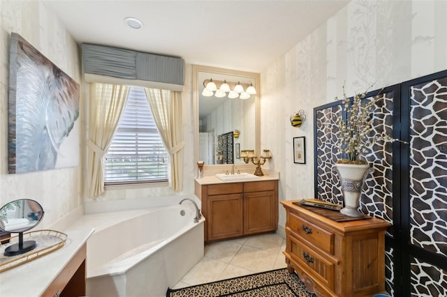 bathroom featuring vanity, a bath, and tile patterned floors