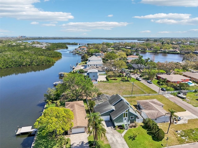 drone / aerial view with a residential view and a water view