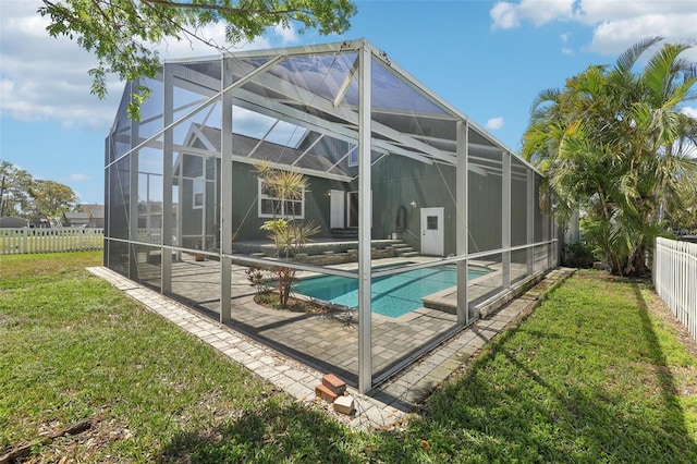 view of pool with a fenced in pool, a lawn, a fenced backyard, a lanai, and a patio area