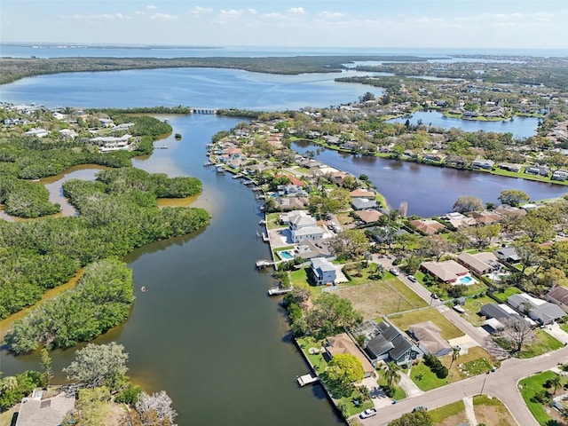 drone / aerial view with a residential view and a water view