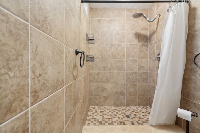 full bath with a shower stall