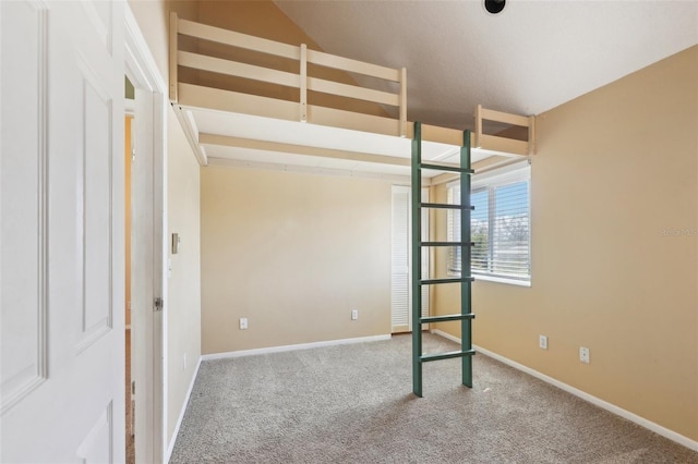 unfurnished bedroom with carpet flooring and baseboards