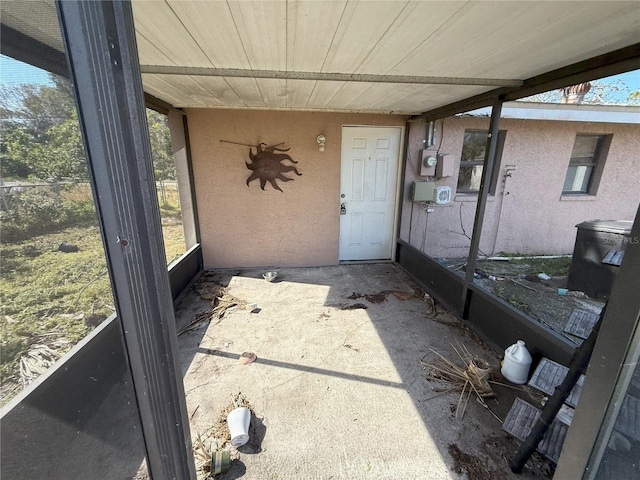 doorway to property with stucco siding