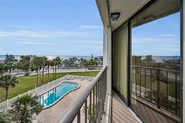 balcony featuring a water view