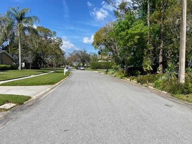 view of road with curbs and sidewalks