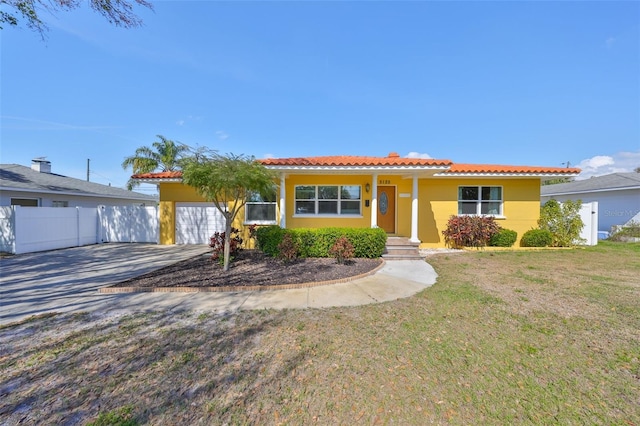 single story home with a tile roof, stucco siding, fence, driveway, and a front lawn