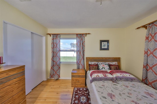 bedroom with wood finished floors