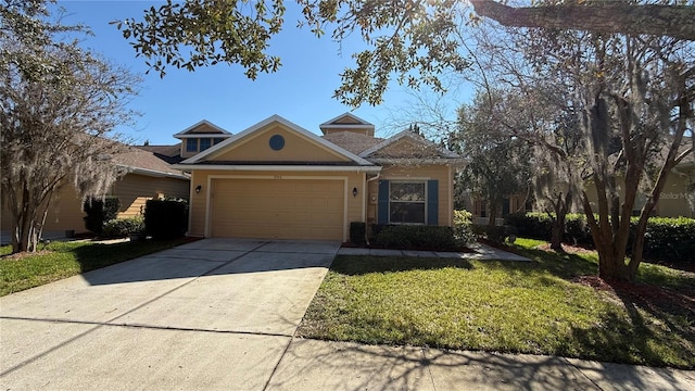 view of front facade featuring a garage, a front yard, and concrete driveway