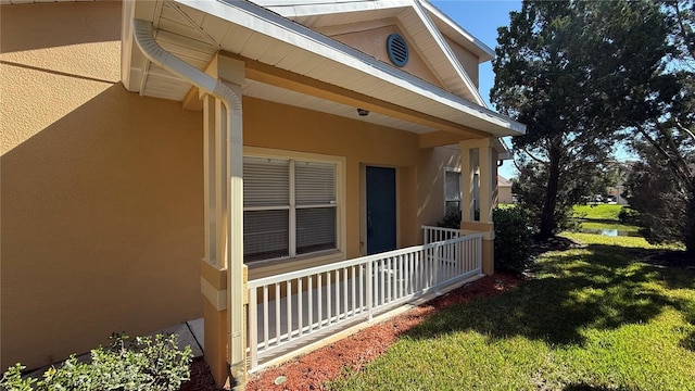 view of property exterior featuring a yard and stucco siding