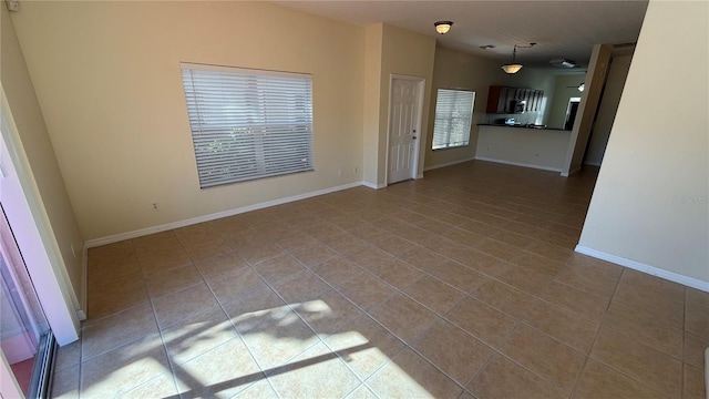 tiled spare room with baseboards