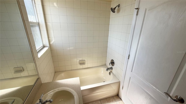 bathroom featuring tile patterned floors, vanity, and washtub / shower combination
