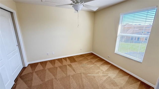 unfurnished bedroom with baseboards, ceiling fan, and carpet floors