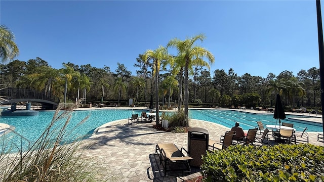 pool featuring a patio area