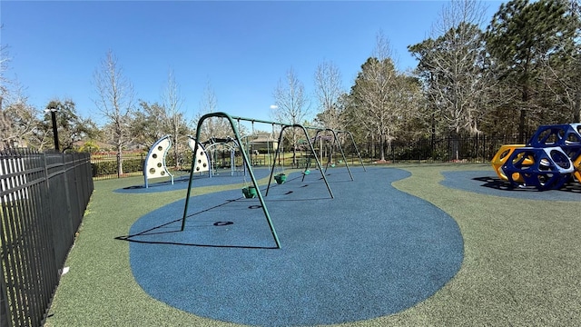 view of home's community with playground community and fence