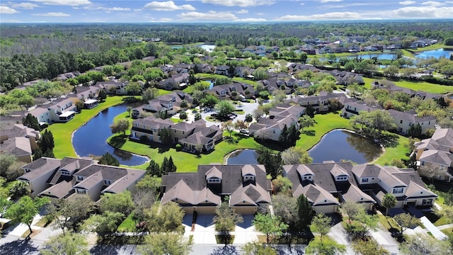 bird's eye view featuring a residential view and a water view