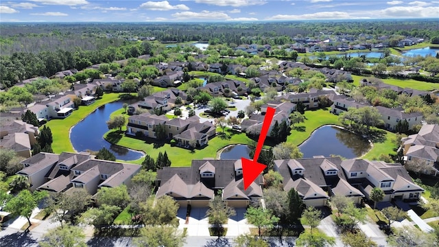 aerial view with a residential view and a water view