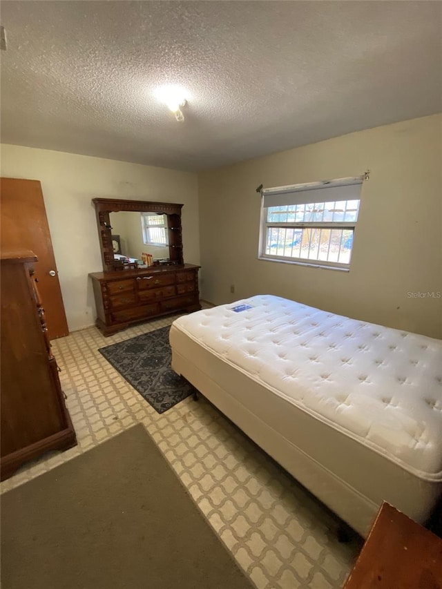 bedroom featuring a textured ceiling