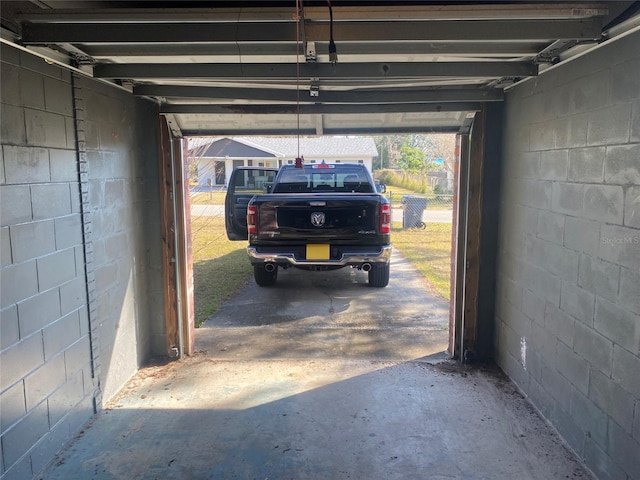 garage featuring concrete block wall