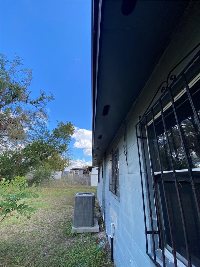 view of yard featuring central air condition unit