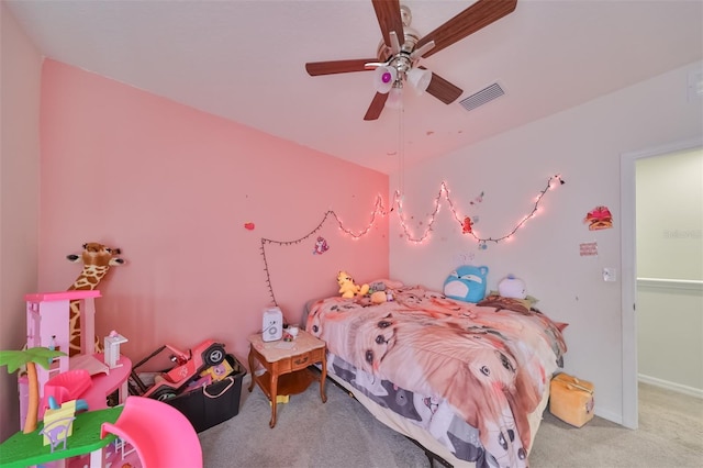 carpeted bedroom with visible vents, ceiling fan, and baseboards