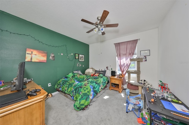 bedroom with a ceiling fan and carpet flooring