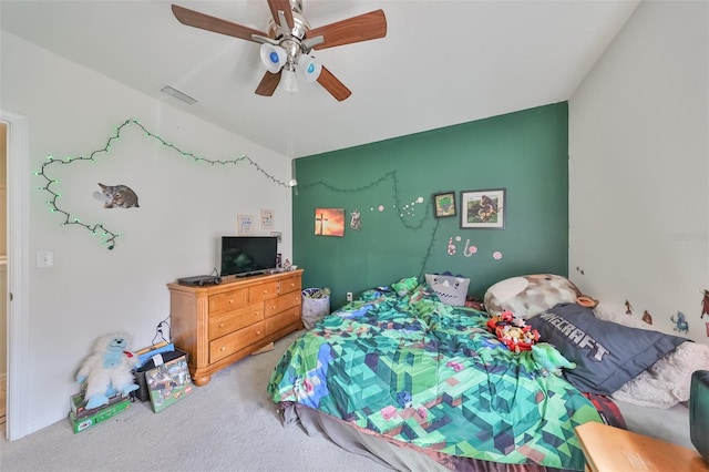 bedroom featuring carpet, visible vents, and a ceiling fan