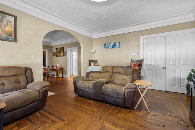 living room with a textured wall, arched walkways, crown molding, and a textured ceiling