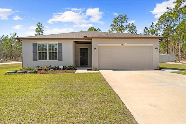 single story home with stucco siding, an attached garage, a front yard, fence, and driveway