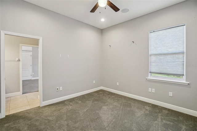 tiled spare room with recessed lighting, carpet flooring, ceiling fan, and baseboards