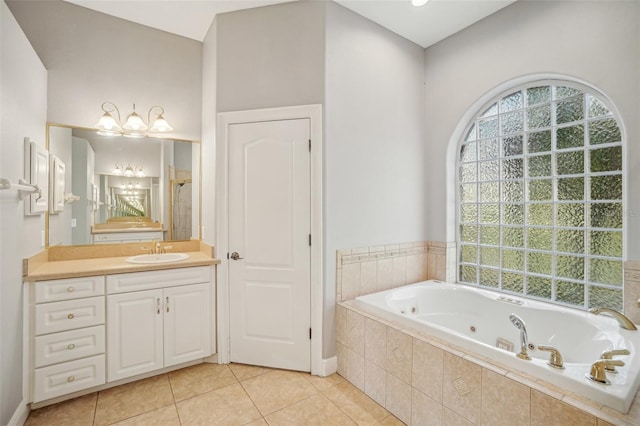 full bath with a whirlpool tub, a shower, tile patterned flooring, and vanity