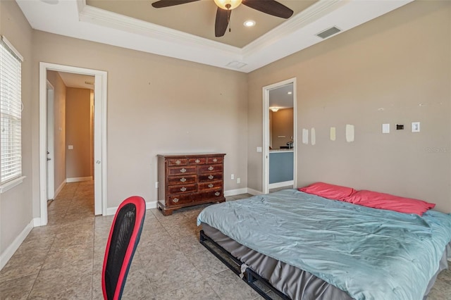 bedroom featuring visible vents, multiple windows, and a tray ceiling