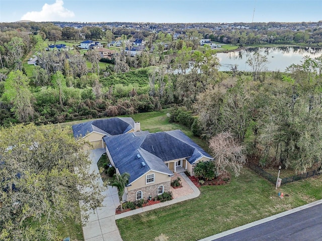 birds eye view of property featuring a water view