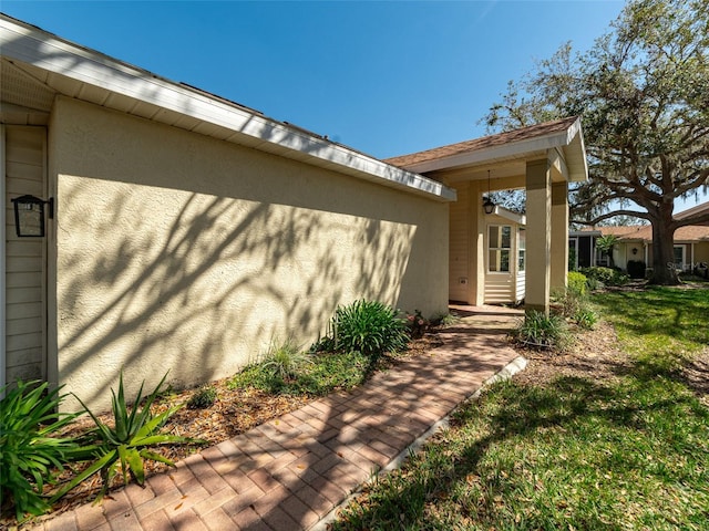 doorway to property with stucco siding