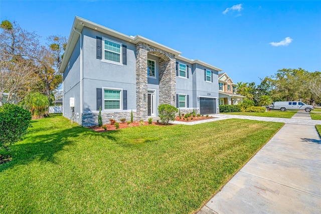 view of front of home featuring stone siding, driveway, a front lawn, and stucco siding