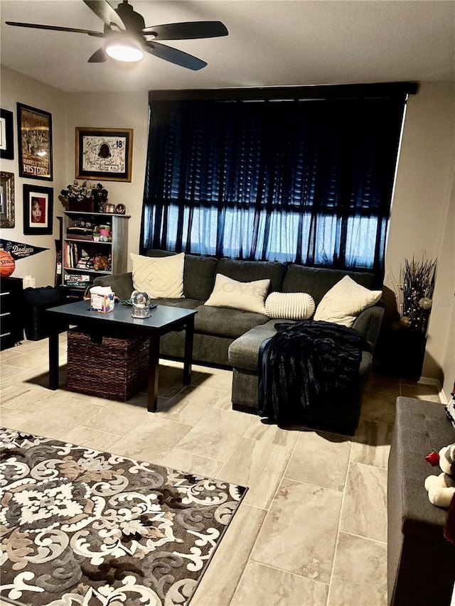 living room featuring a ceiling fan