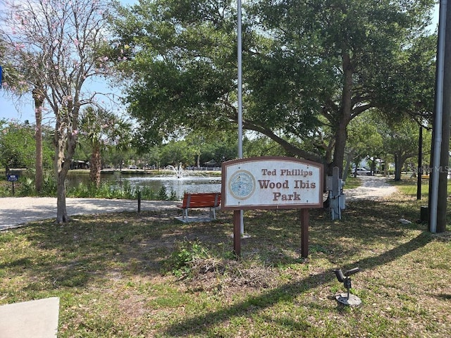 surrounding community featuring a water view